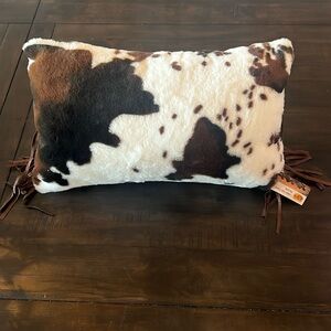 Cow Print Throw Pillow with tassels Faux Suede Back 
Cracker Barrel
19x10”